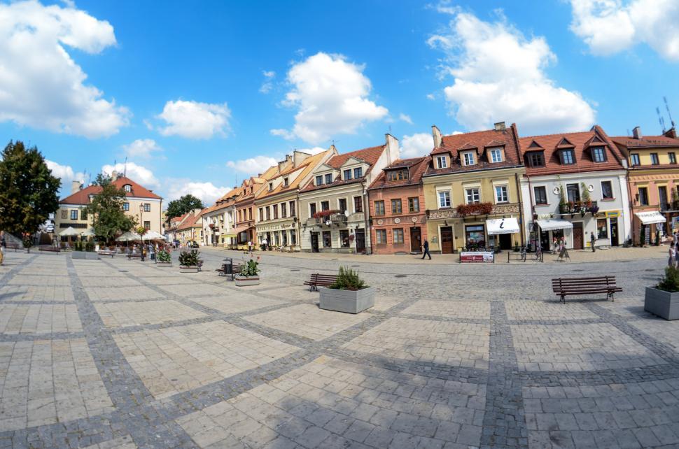 Free Image of Urban Square With Benches and Buildings 