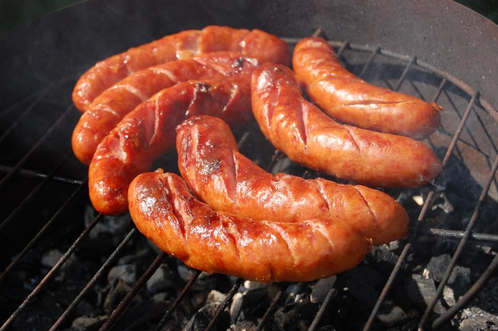 Free Image of Hot Dogs Cooking on a Grill 