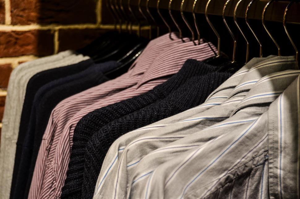 Free Image of Row of Clothes Hanging on a Rack 