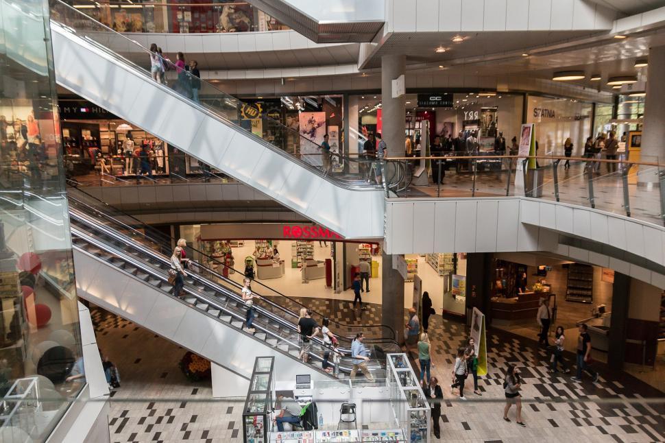 Free Image of Group of People Walking Around a Shopping Mall 