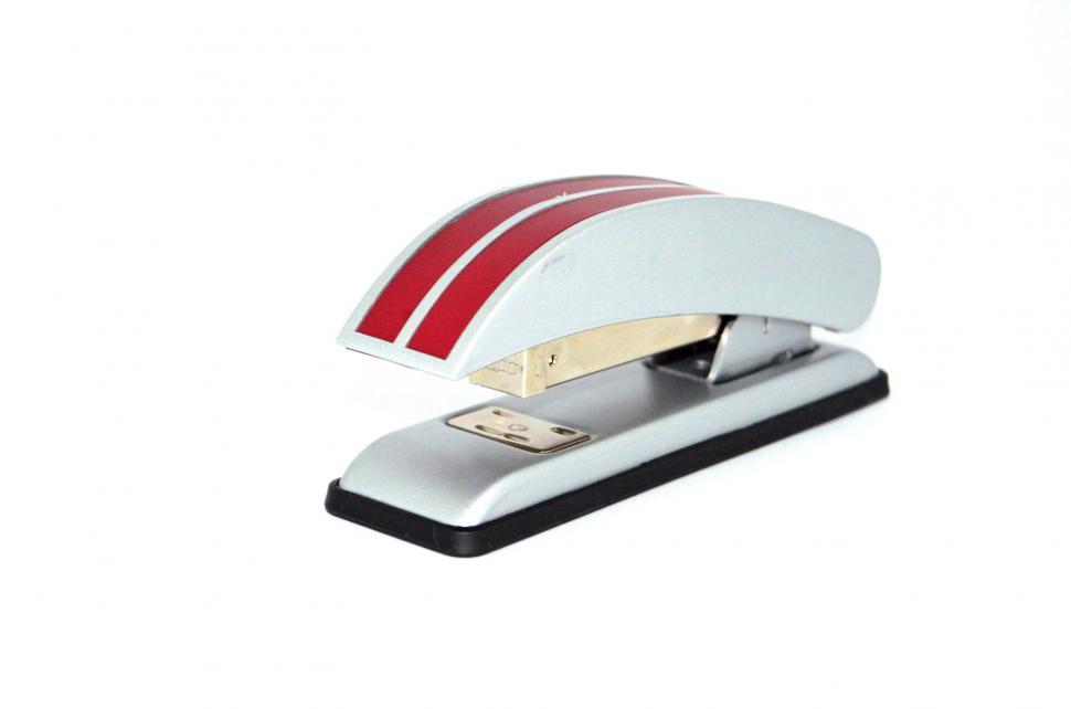 Free Image of Red Striped Stapler on Desk 