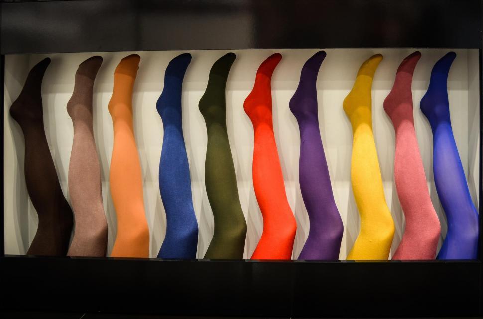 Free Image of Assorted Colored Socks Hanging on a Wall 