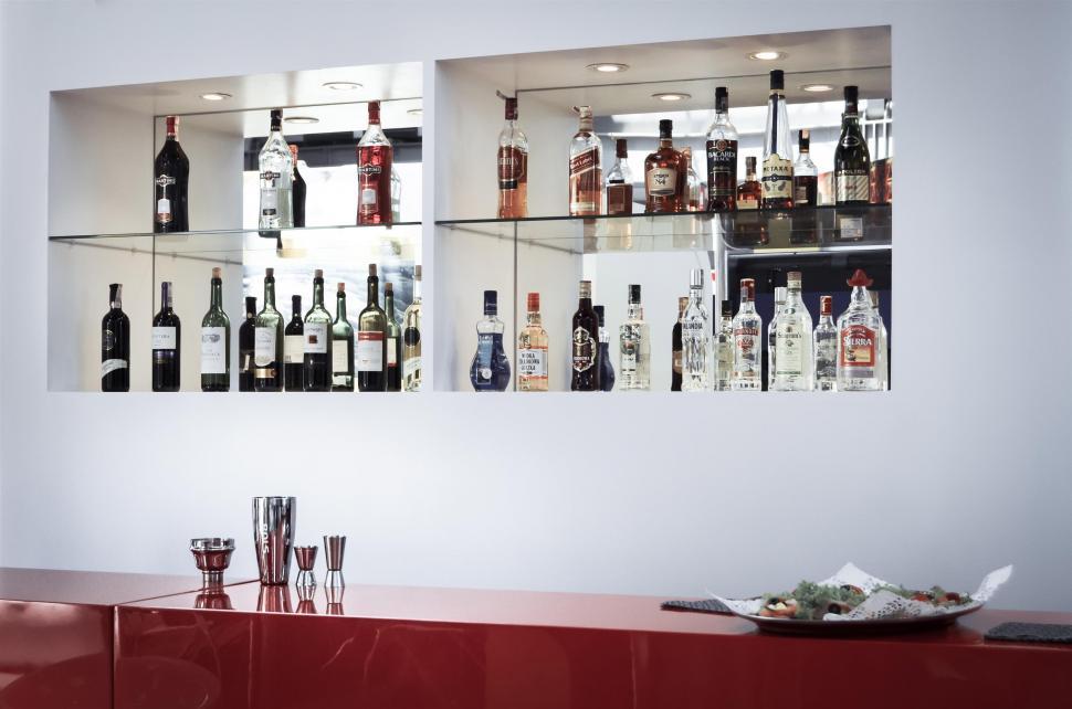 Free Image of Variety of Liquor Bottles Displayed on a Bar 