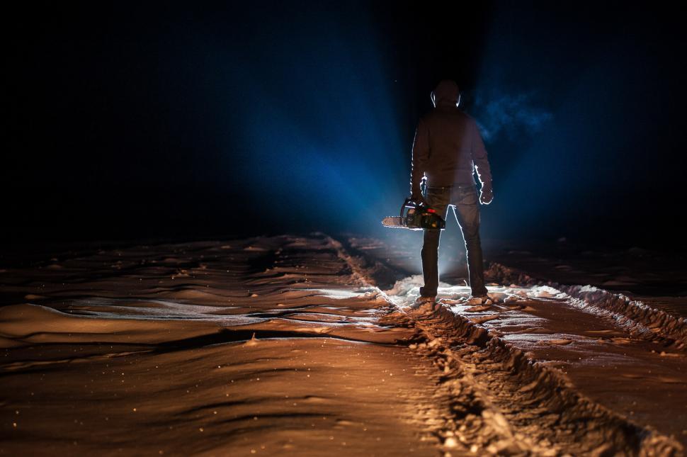 Free Image of Man Standing in Middle of Road at Night 