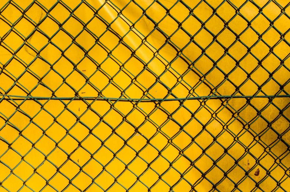 Free Image of Close-Up of Fence Against Yellow Background 