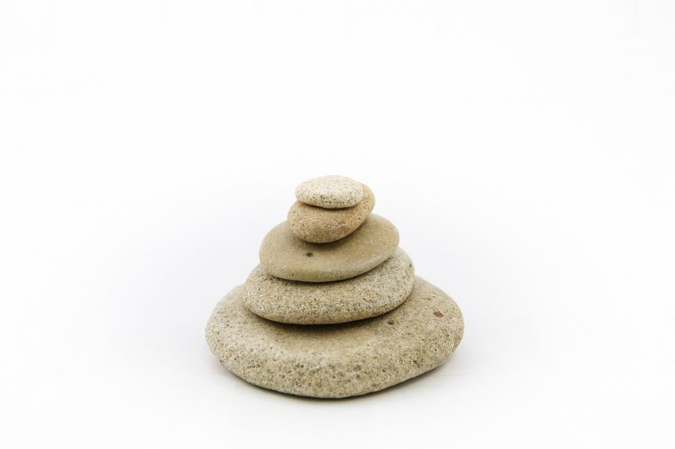 Free Image of Stack of Rocks on White Surface 