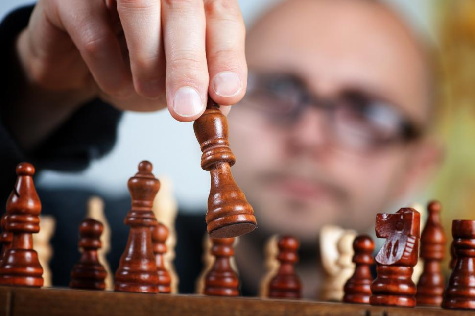 Free Image of Man Strategically Playing a Game of Chess 