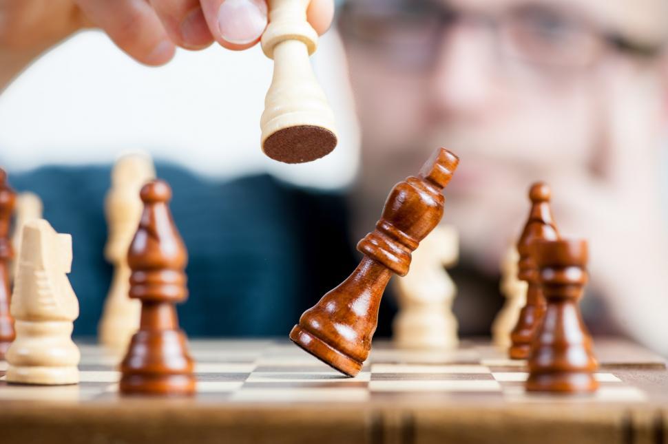 Free Image of A Person Playing a Game of Chess 