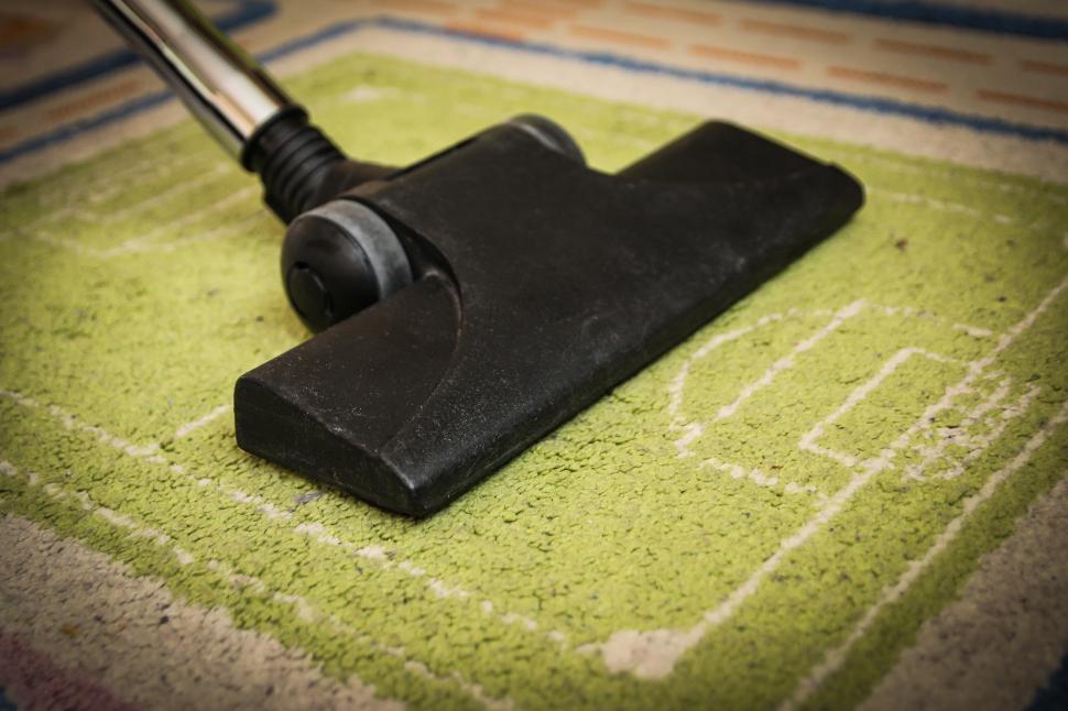 Free Image of Close Up of Vacuum on Carpet 