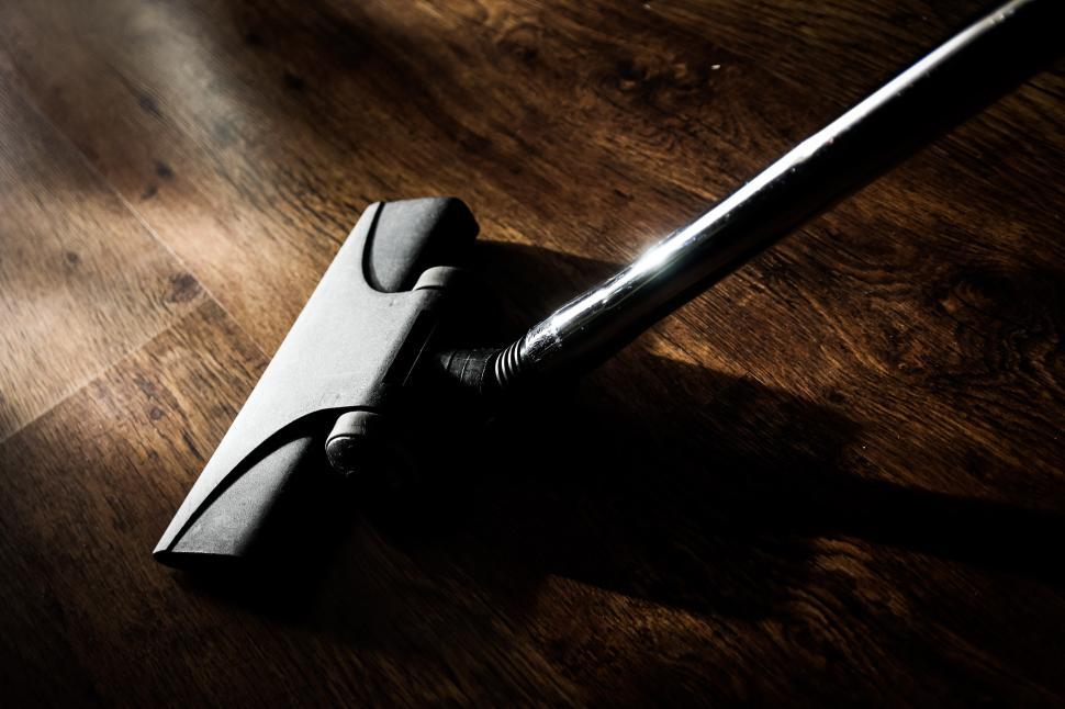 Free Image of A Knife Rests on a Wooden Floor 