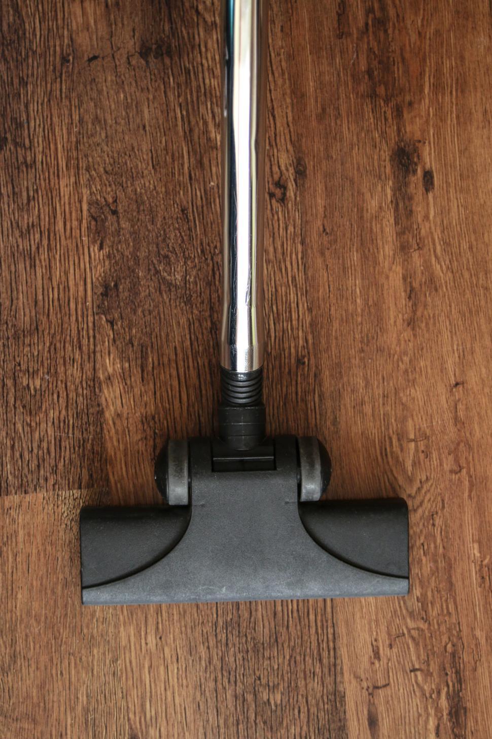 Free Image of Close Up of a Vacuum on a Wooden Floor 
