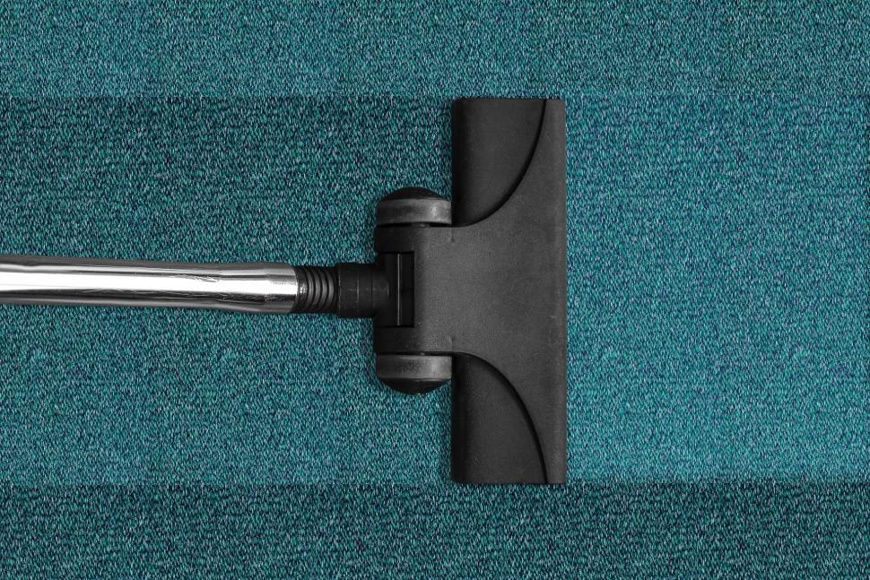 Free Image of Blue Carpet With Black Handle 