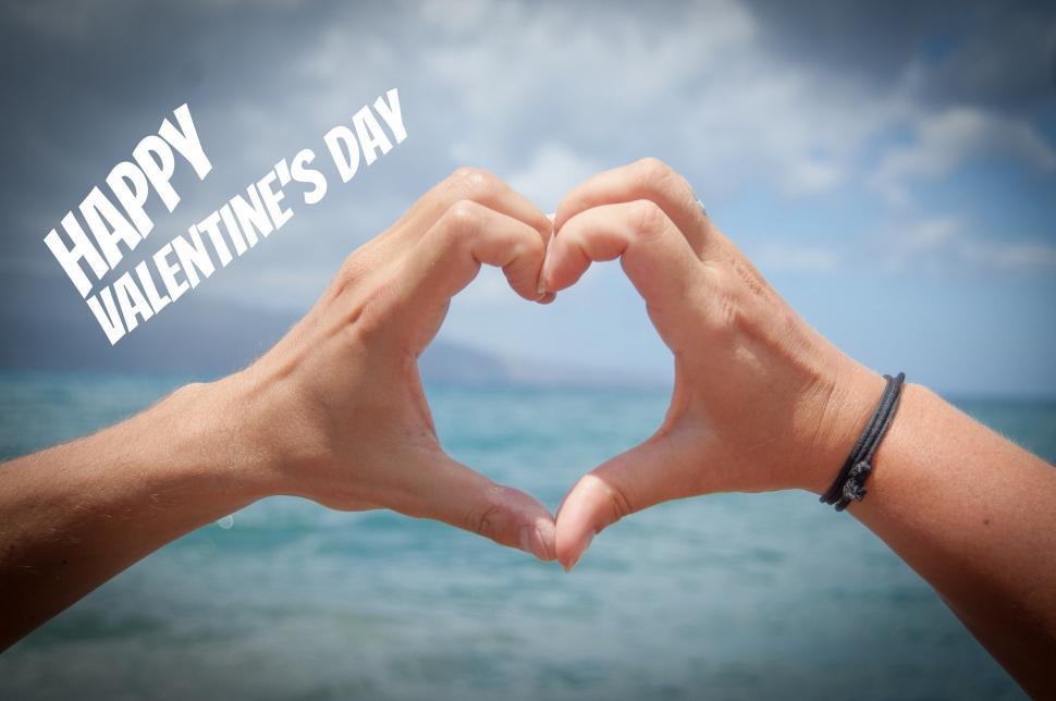 Free Image of Hands Forming Heart Shape With Happy Valentines Day Message 