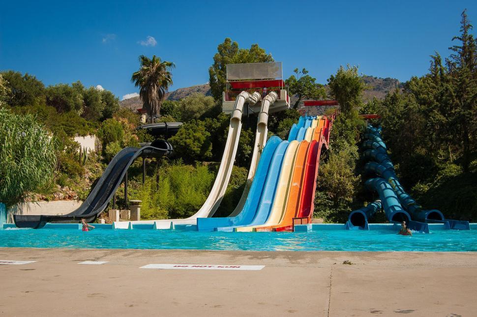 Free Image of Water Slide in Swimming Pool With Background Slide 