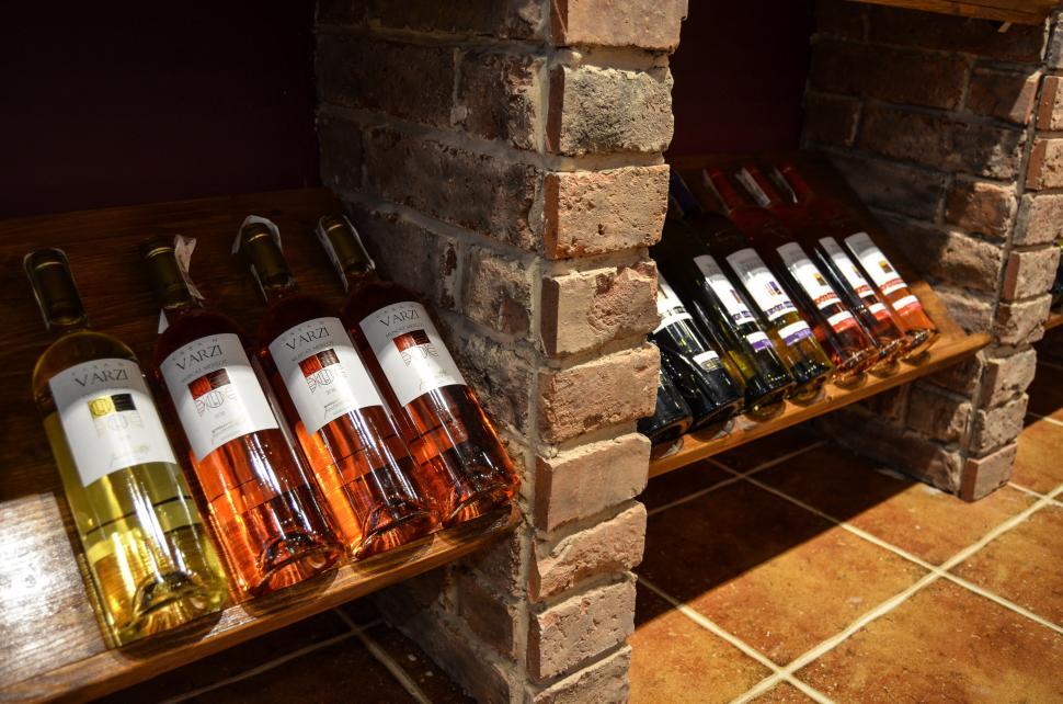 Free Image of Row of Bottles of Wine on Wooden Shelf 