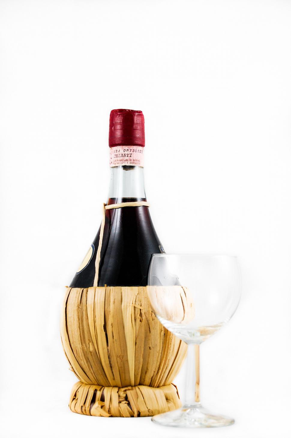 Free Image of Bottle of Wine Next to Wine Glass 