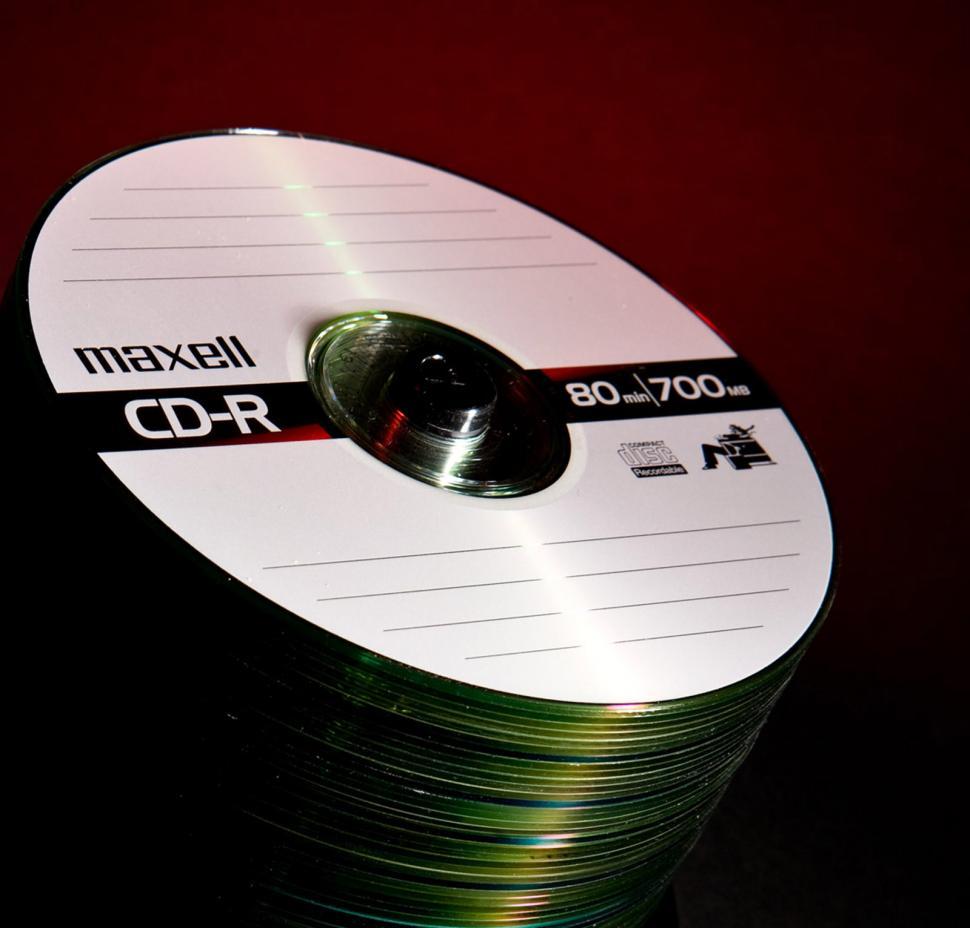 Free Image of Stack of CDs on Table 