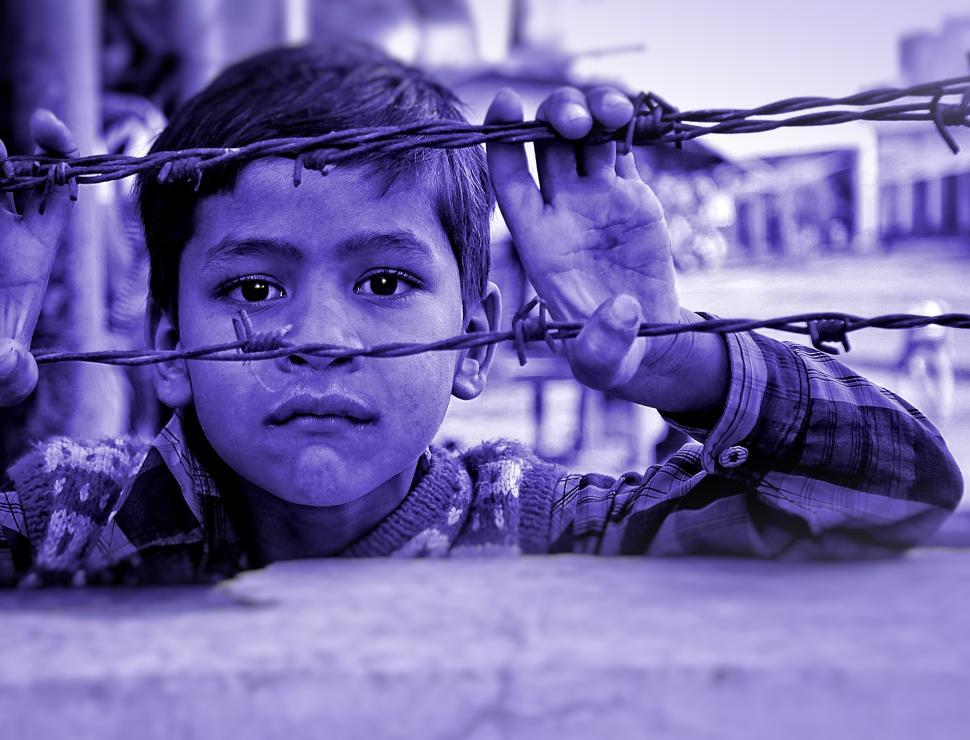 Free Image of Child and Barbed Wire 