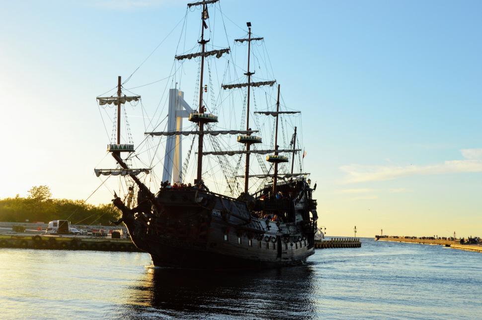 Free Image of Tourist old sailing ship Galleon enters the harbor after an excursion or trip in the sea. The Baltic Sea 