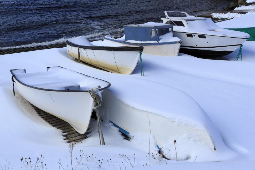 Free Image of Snow covered fishing boats on slipway 