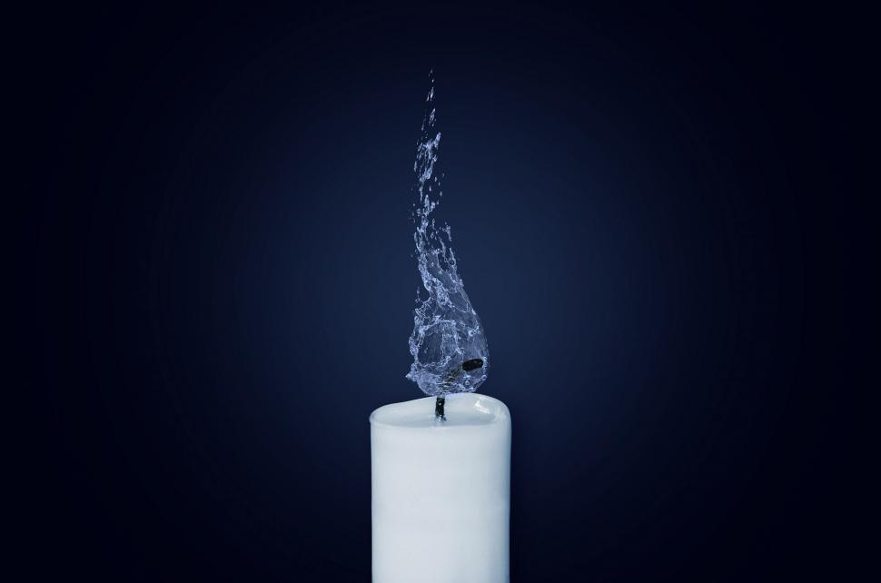 Free Image of White Candle Emitting Blue Flame 