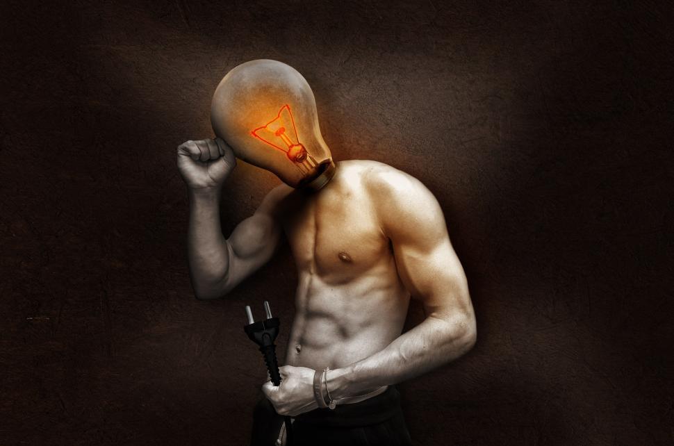 Free Image of Man With a Light Bulb on His Head 