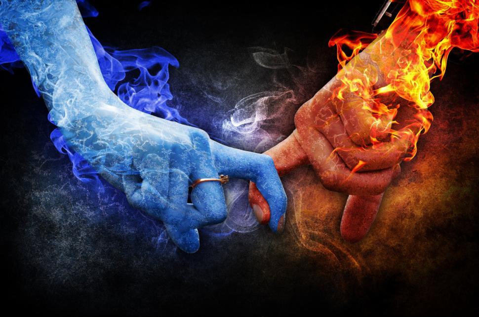 Free Image of Intertwined Hands With Fire and Smoke Background 