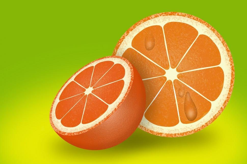 Free Image of Two Halves of Grapefruit on Green Background 