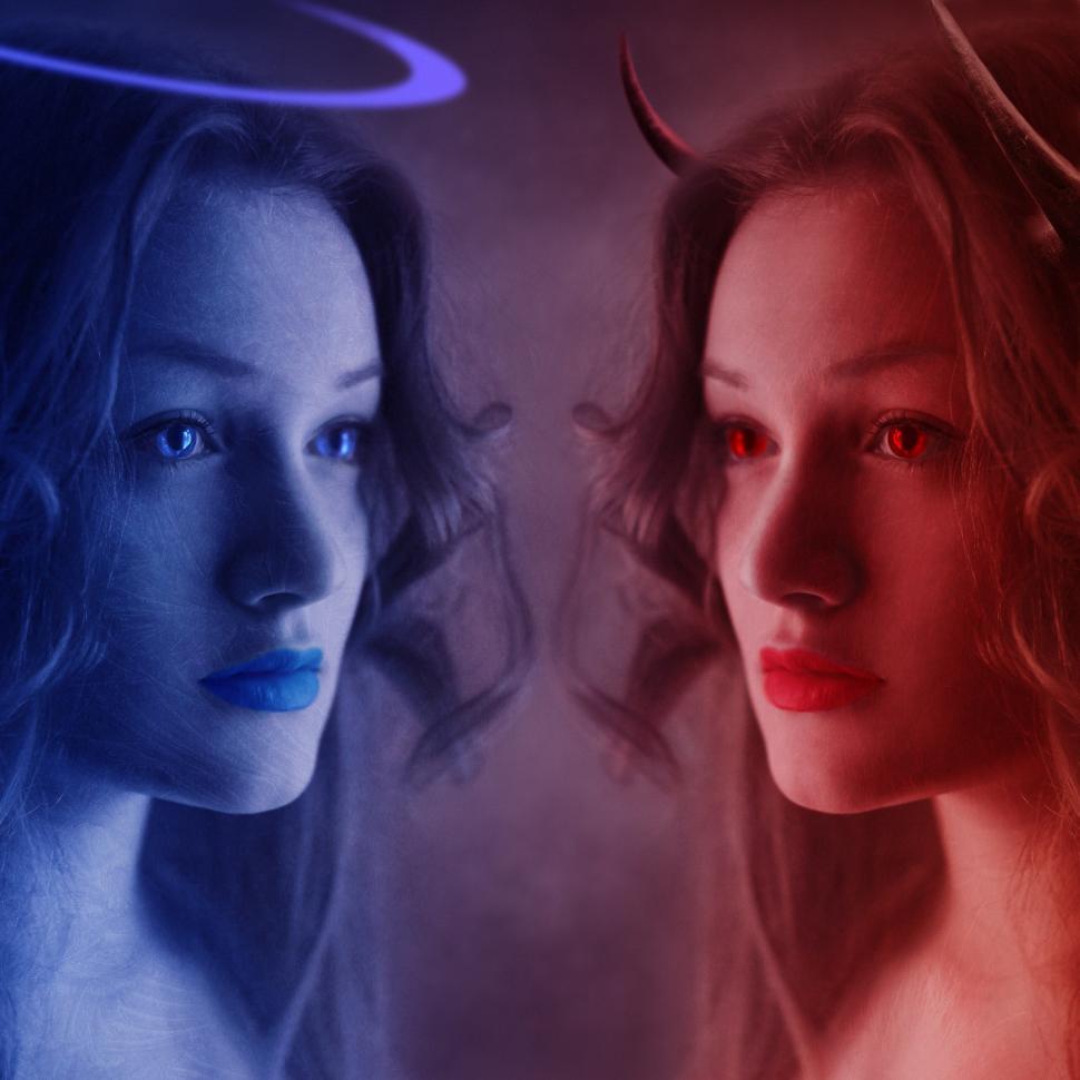 Free Image of Two Women Illuminated by Blue and Red Lights 
