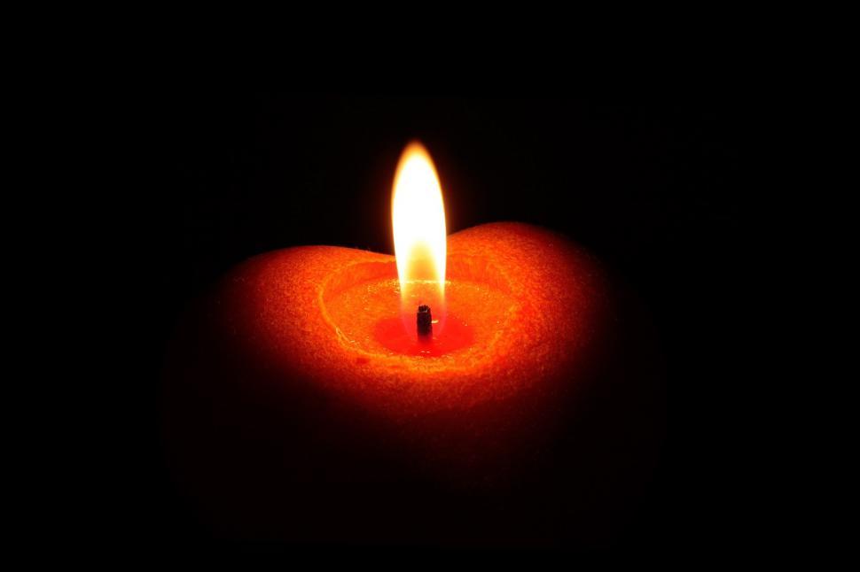 Free Image of Illuminated Candle in Dark Space 