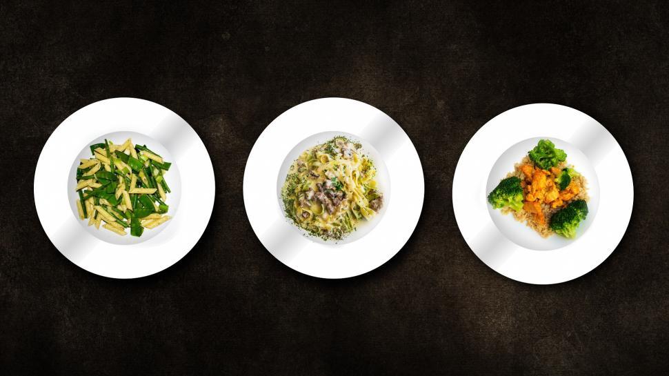 Free Image of Three White Plates With Different Types of Food 