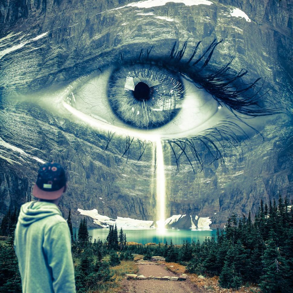 Free Image of Man Standing in Front of an Eye 