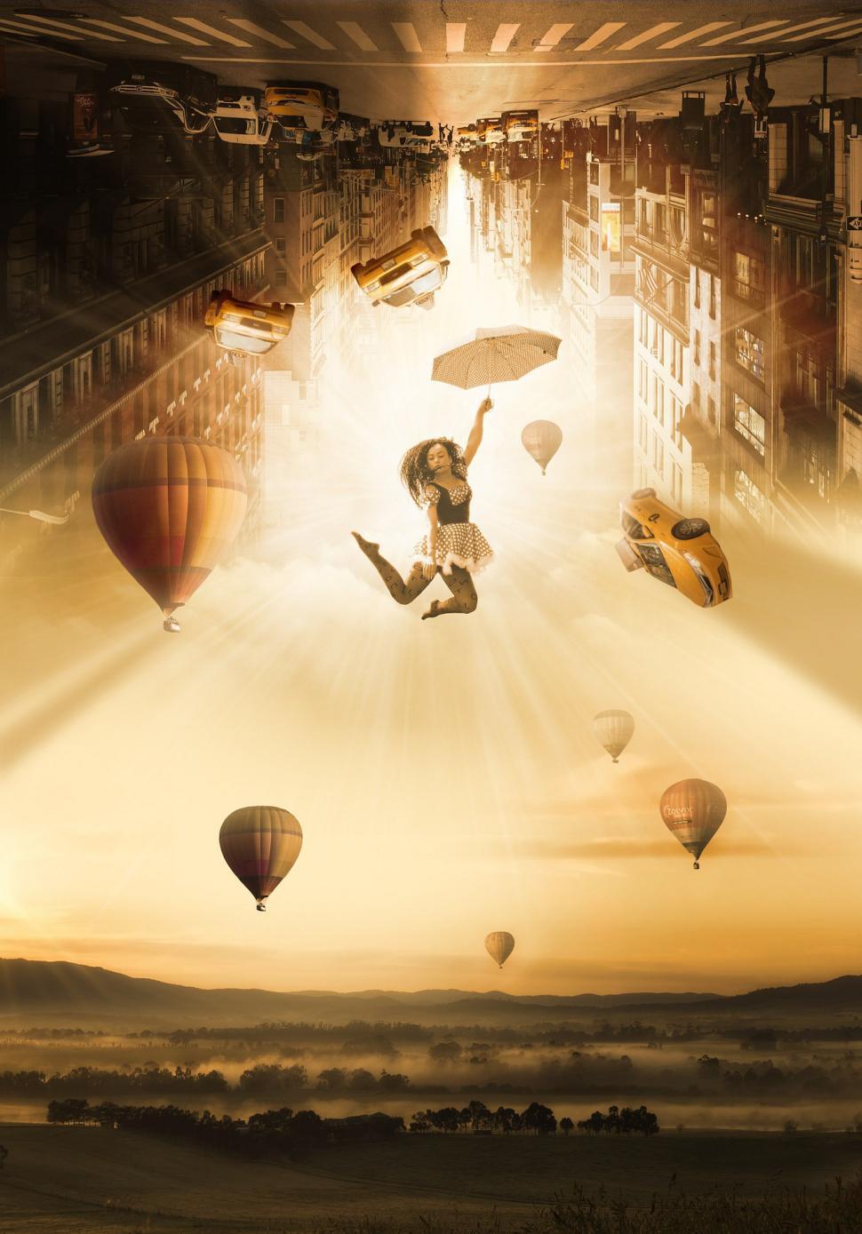 Free Image of Woman Flying Through the Air Surrounded by Hot Air Balloons 
