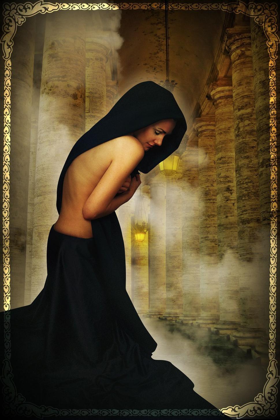 Free Image of Woman in Black Dress Smoking a Cigarette 