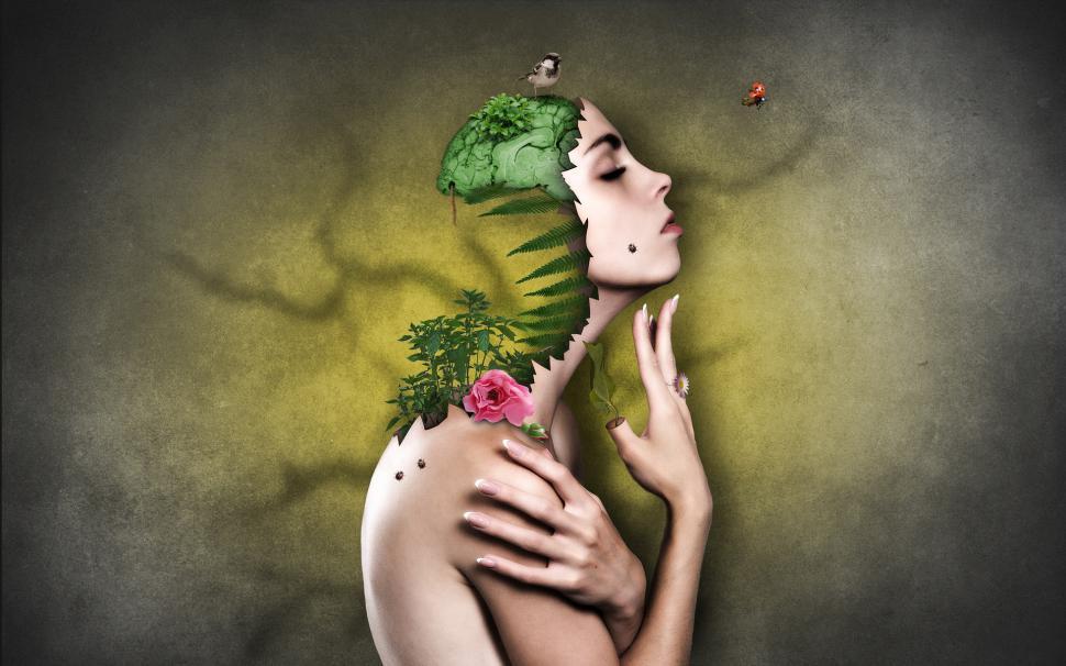 Free Image of Womans Face Painting With Plant Sprouting 