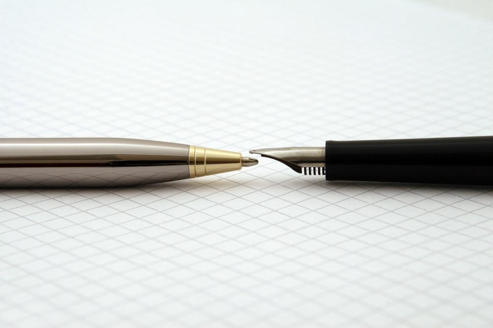 Free Image of Pen Resting on Top of Paper 