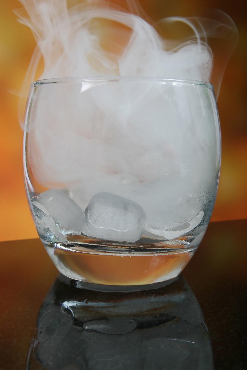 Free Image of Glass Filled With Ice and Water on Table 