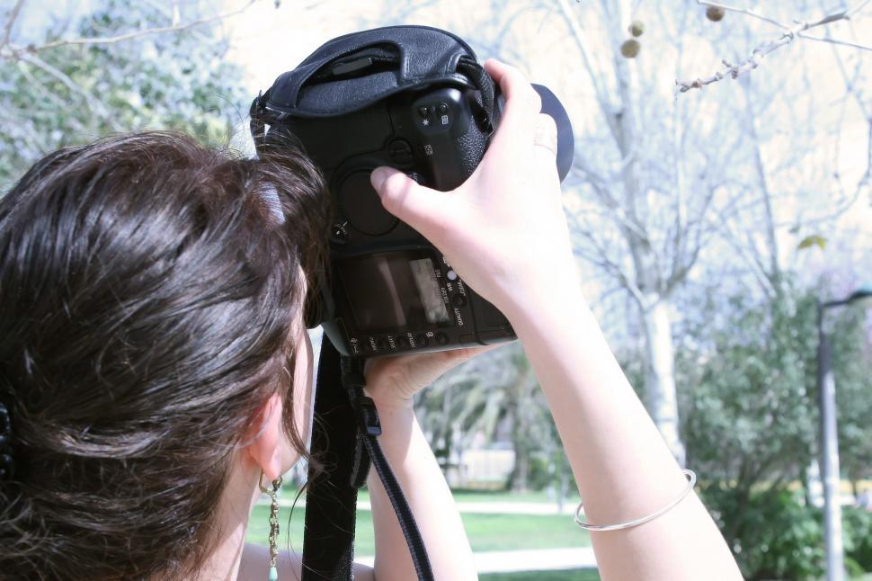 Free Image of Woman Holding Camera Up to Face 