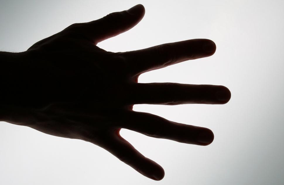 Free Image of Persons Hand Reaching Up Into the Sky 