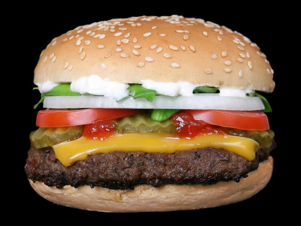 Free Image of black background hamburger cheeseburger sandwich snack food dish food lunch bread meal dinner cheese lettuce tomato meat bun snack fast burger delicious beef tasty onion 