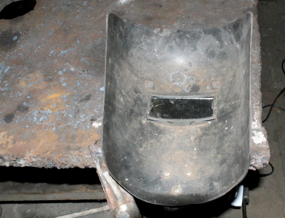Free Image of Metal Helmet on Table 