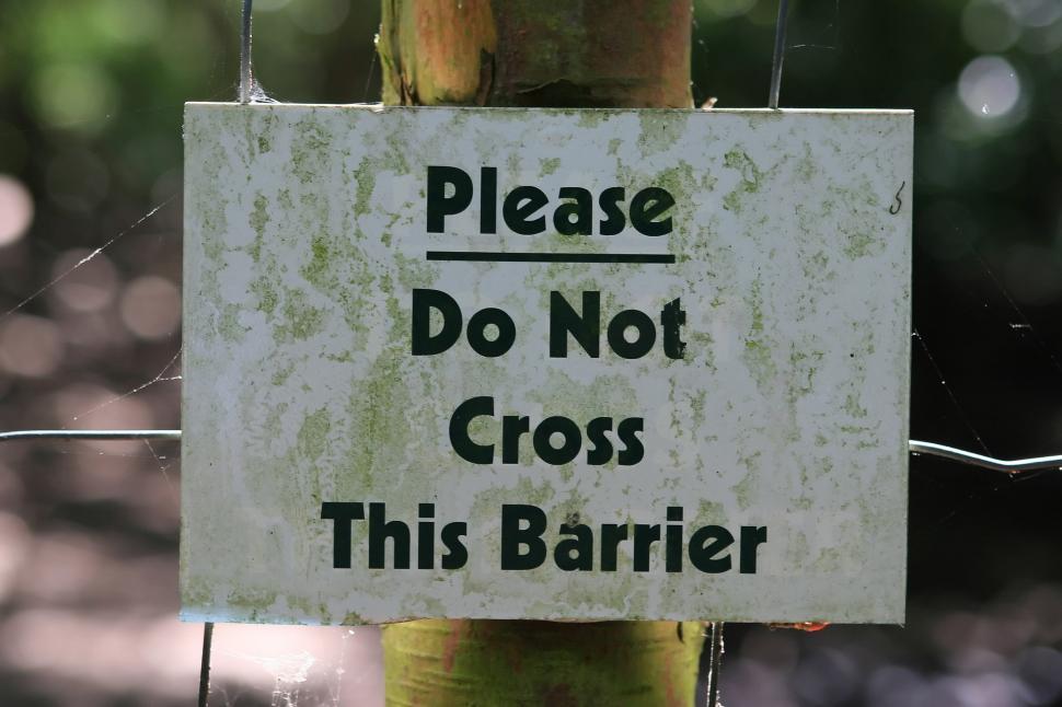 Free Image of Warning Sign on Fence: Do Not Cross 