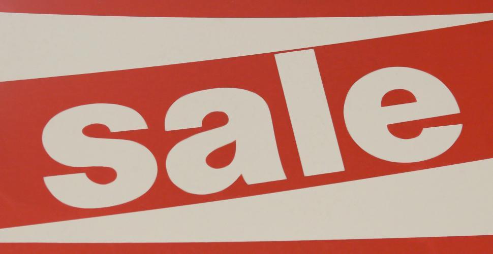 Free Image of Red and White Sale Sign With the Word Sale 