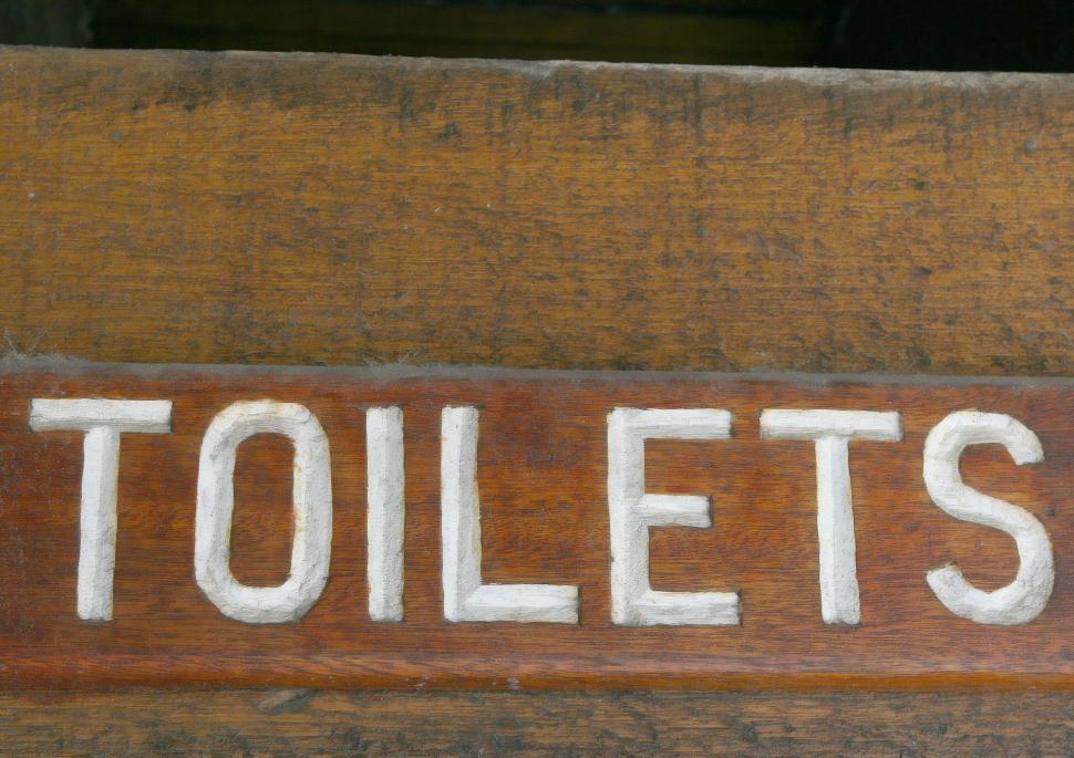 Free Image of Close Up of Sign on Wooden Door 