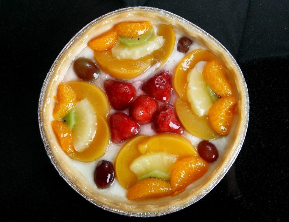 Free Image of Delicious Fruit Topped Pie on Table 