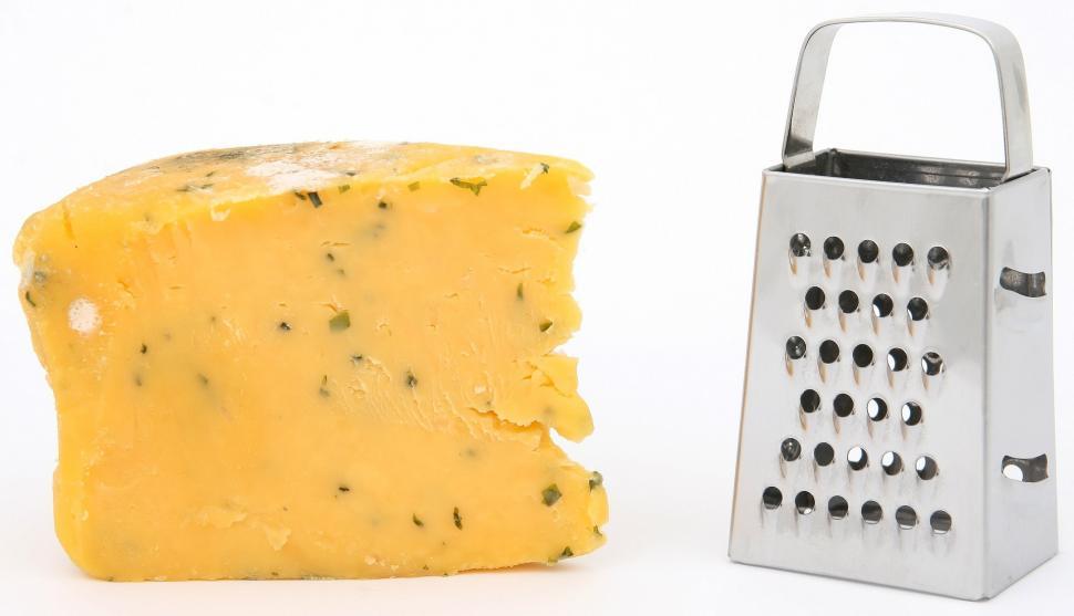 Free Image of Cheese Grater Beside Slice of Cheese 