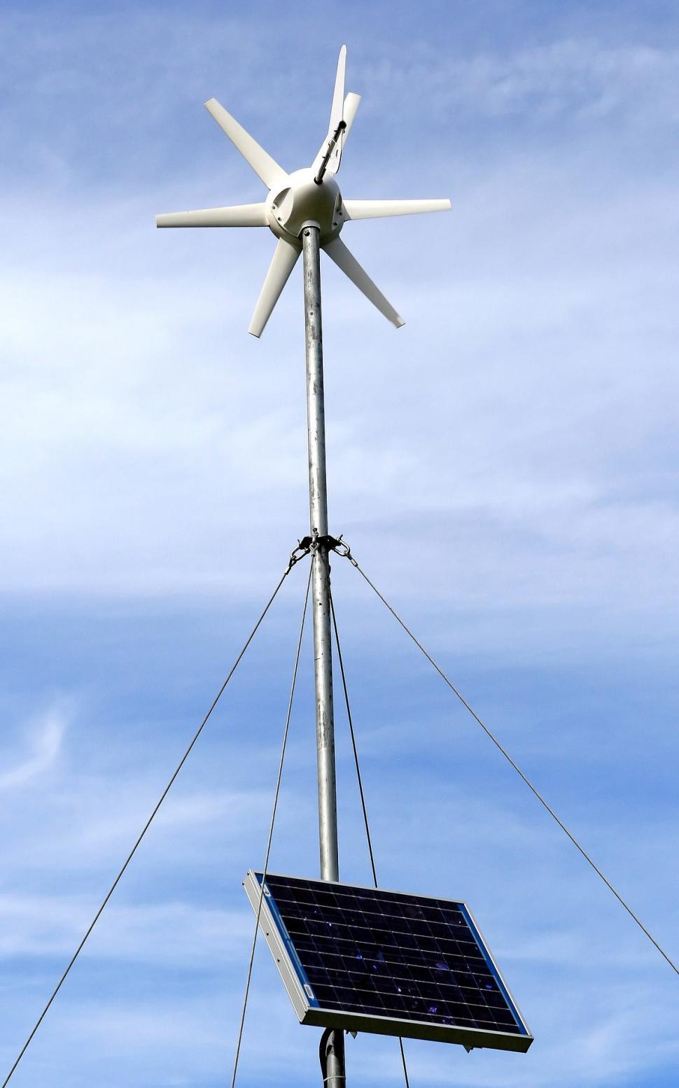 Free Image of Wind Turbine With Attached Solar Panel 