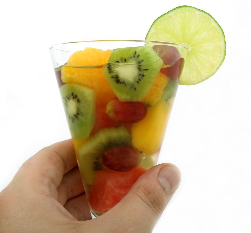 Free Image of Hand Holding Glass of Fruit Salad 
