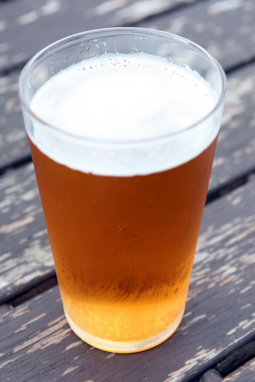 Free Image of Glass of Beer on Wooden Table 