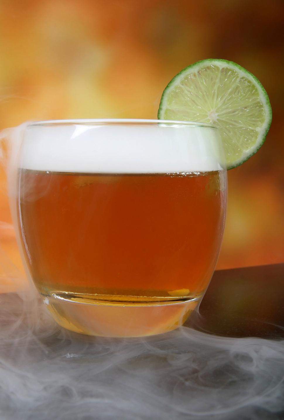 Free Image of A Cup of Tea With a Lime on Top 